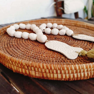 Chapelet poisson avec ponpon-doré