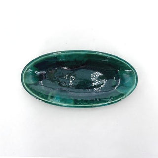 Plat ovale vert en céramique pour fruits secs